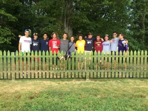 Several of our First-Year men behind the mirror fence at Storm King Art Center