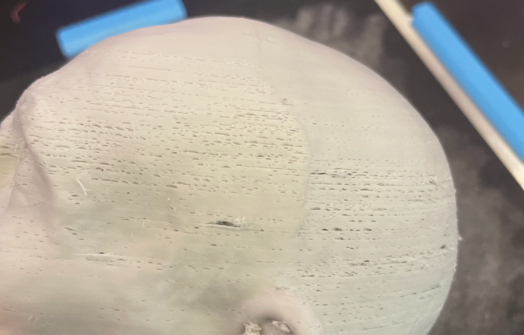 The under-extrusion was far more noticeable on the first print of the mask than the bust.