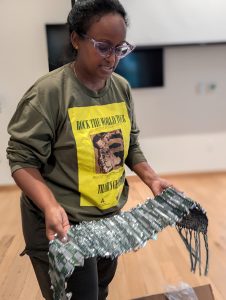 Tsedaye Makonnen unpacking and seeing the woven mylar demo for the first time.
