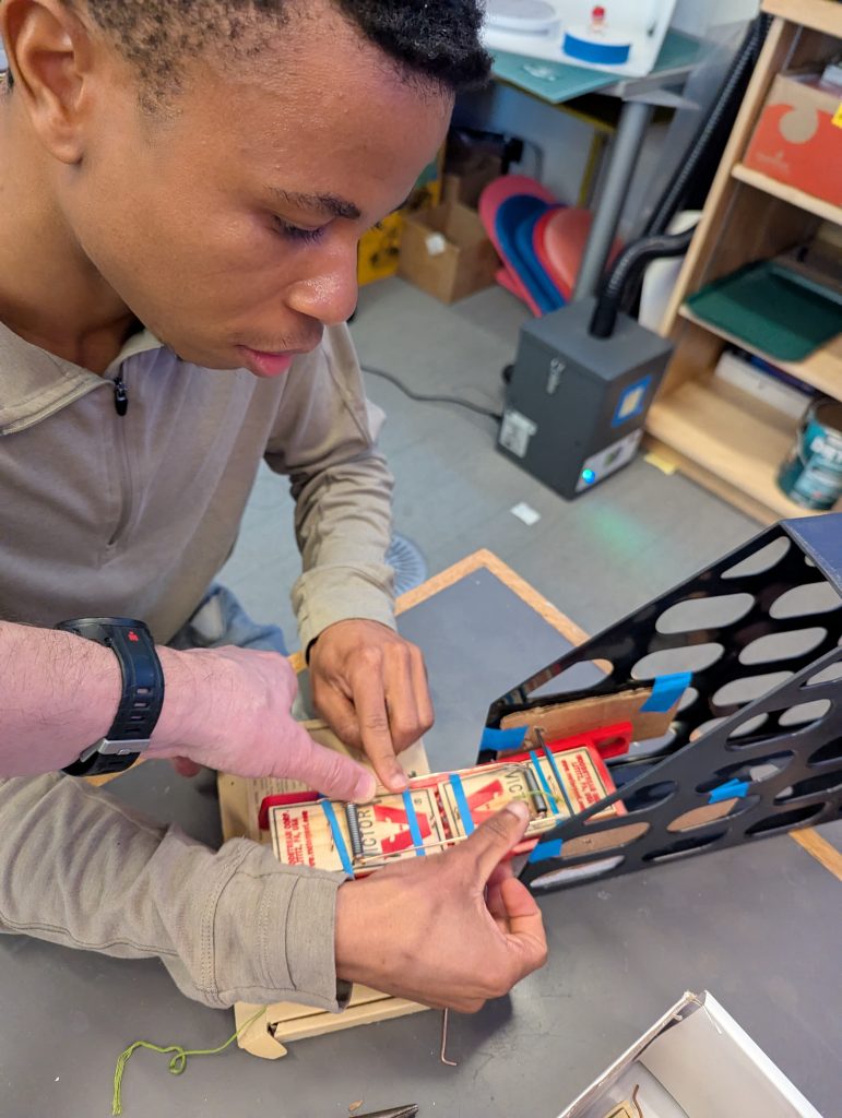 Mousetrap car rapid prototyping: testing trigger mechanism in makeshift compartment
