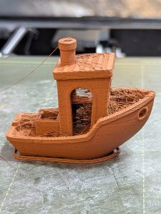 A photo of the copper infused PLA printed Benchy before the oxidization process.