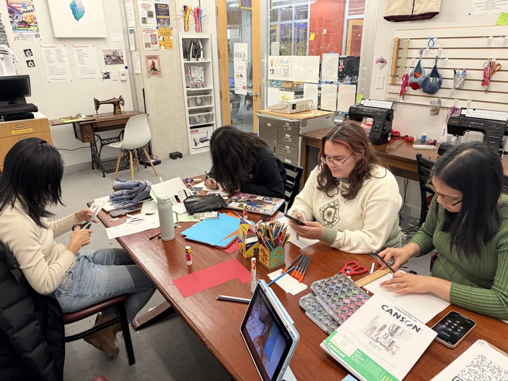 Participants creating their unique versions of 3D gift cards for their friends and family during the International Education Week (photo by Carmen).