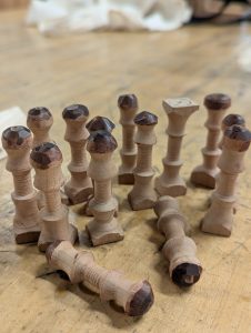 14 tuning bulges, turned on the lathe, and some have been sanded on the disc sander, while others await that final treatment.