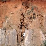 Development of lavaka erosion above and behind roadcut in laterite/saprolite
