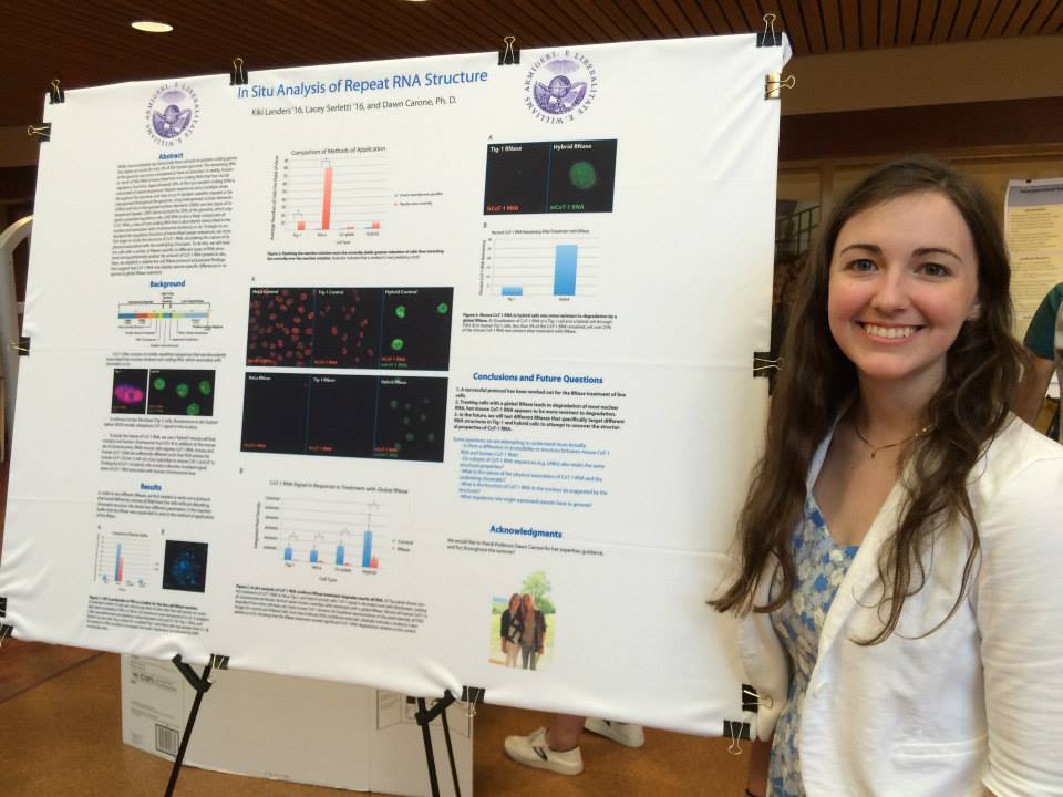 Kiki presents her poster after a summer of working on her project.